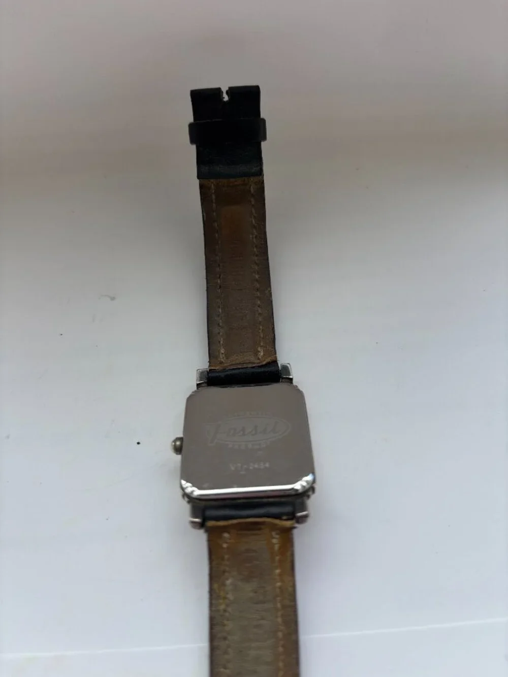 Vintage Fossil watch in Art Deco style with silver bezel and square face